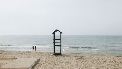 Scenic view of beach against clear sky