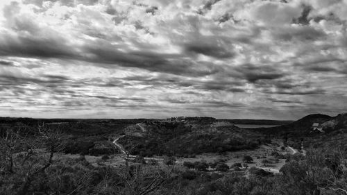 Scenic view of landscape against cloudy sky