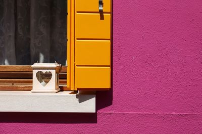 Close-up of yellow closed door of building