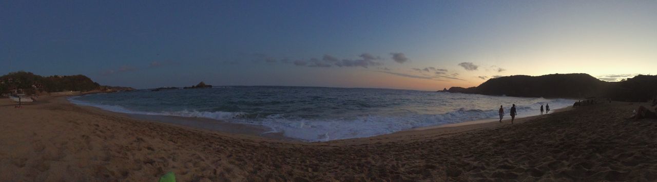 sea, water, beach, scenics, tranquil scene, horizon over water, shore, tranquility, beauty in nature, sand, nature, coastline, sky, idyllic, copy space, clear sky, incidental people, sunset, panoramic, vacations