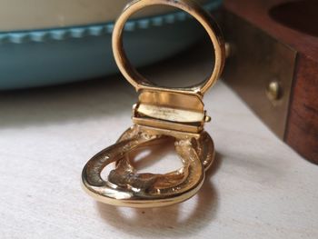 Close-up of wedding rings on table