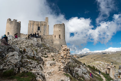 Low angle view of castle against cloudy sky