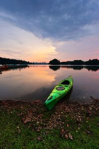 Scenic view of lake against sky at sunset
