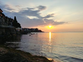 Scenic view of sea against sky during sunset