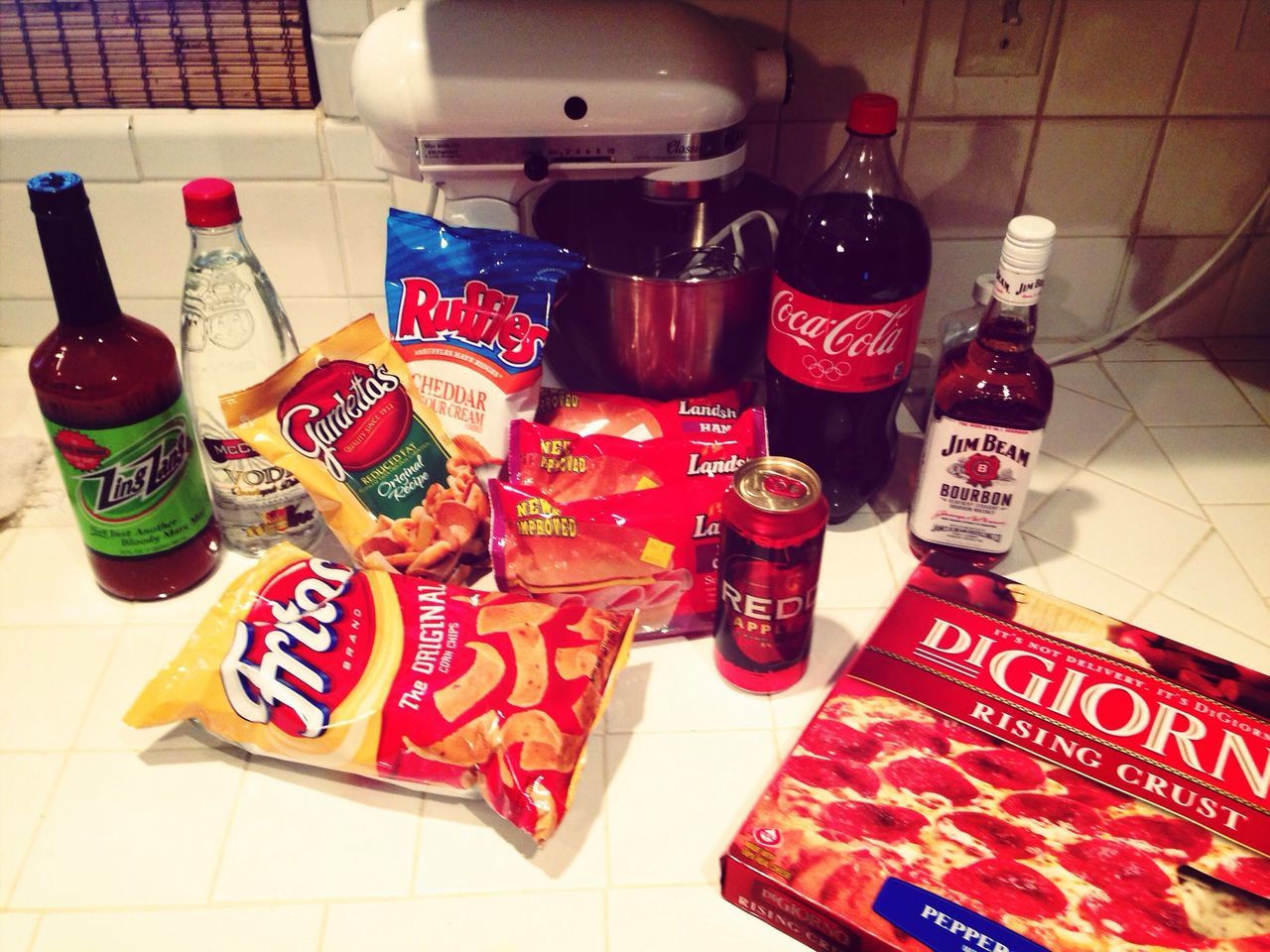 indoors, text, still life, variation, table, high angle view, communication, choice, large group of objects, western script, arrangement, no people, red, multi colored, tiled floor, food and drink, flooring, tile, in a row, order