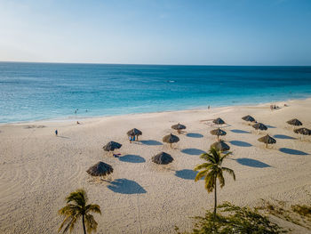 Scenic view of beach against clear sky