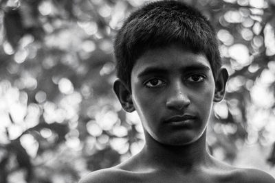 Portrait of shirtless boy outdoors