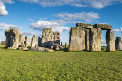 Old ruins on field against sky