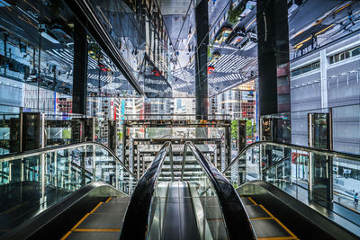 Illuminated railroad tracks in city