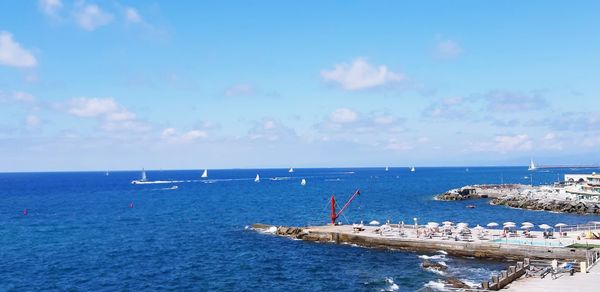 Scenic view of sea against blue sky