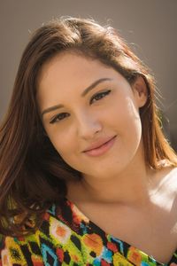 Close-up portrait of a smiling young woman