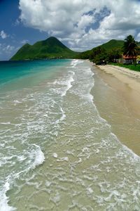 Scenic view of sea against cloudy sky
