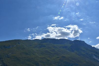 Scenic view of mountains against blue sky