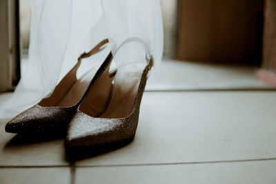 Close-up of sandals on table