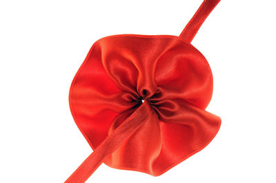 Close-up of red umbrella against white background
