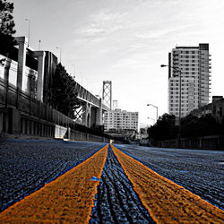 View of railroad tracks in city against sky