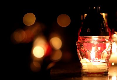 Close-up of illuminated light candles on table