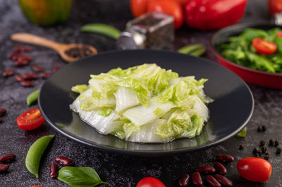 High angle view of chopped vegetables in bowl on table