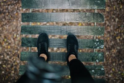Low section of man standing on staircase