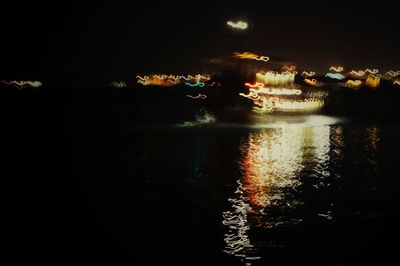 View of illuminated river at night