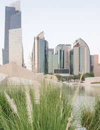 Buildings in city against clear sky