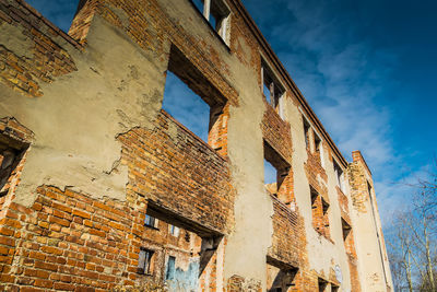 Low angle view of old building against sky