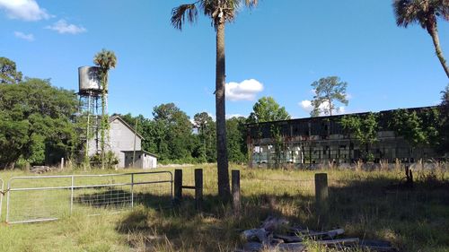 Abandoned built structure on field against sky