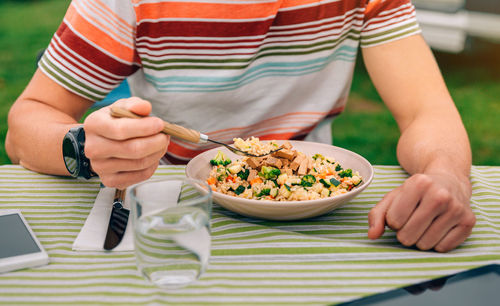 Man eating vegan food outdoors