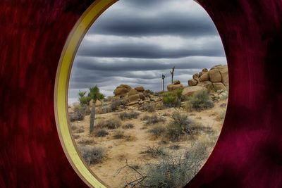 View of landscape against cloudy sky