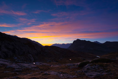 Scenic view of mountains against sky during sunset