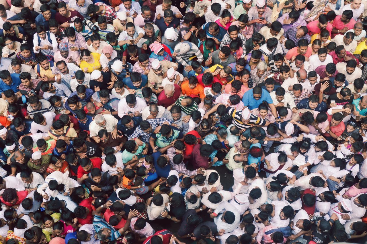 crowd, large group of people, group of people, real people, high angle view, full frame, women, togetherness, men, leisure activity, standing, adult, lifestyles, architecture, multi colored, day, enjoyment, backgrounds, outdoors