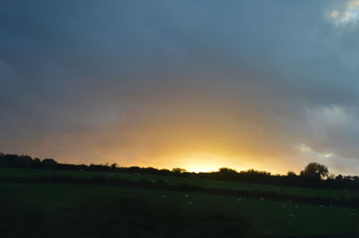 Scenic view of landscape against sky at sunset