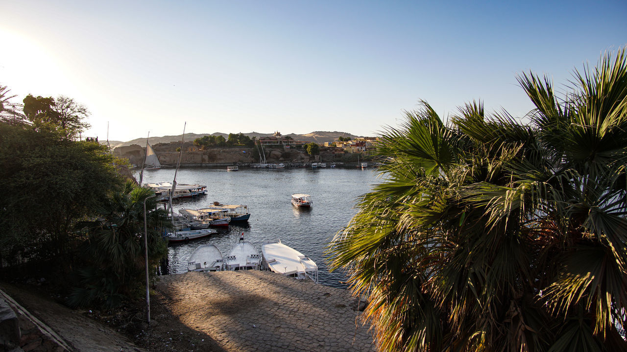 BOATS MOORED IN RIVER