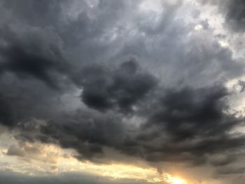 Low angle view of storm clouds over dramatic sky