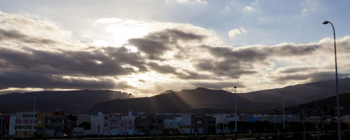 Scenic view of mountains against cloudy sky