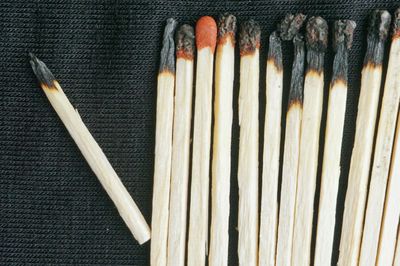 Close-up of matchsticks on fabric