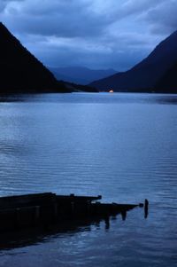Scenic view of lake against sky at dusk