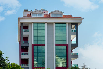 Low angle view of an apartment building with balconies. residential real estate.