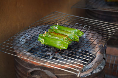 High angle view of meat on barbecue grill