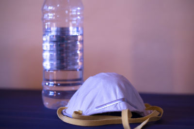 Close-up of glass bottle on table