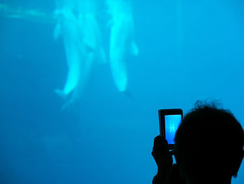 Man photographing at sea