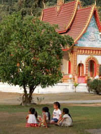 People sitting outside building