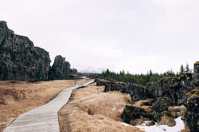 Panoramic view of rocks and trees against sky