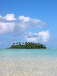 Scenic view of sea against blue sky