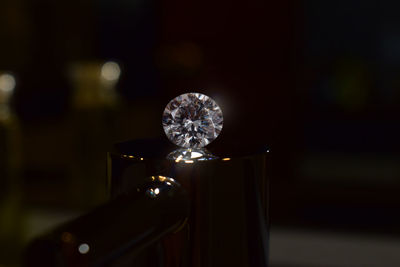 Close-up of electric lamp on table