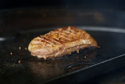 High angle view of meat on barbecue grill