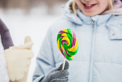 Midsection of woman holding ice cream