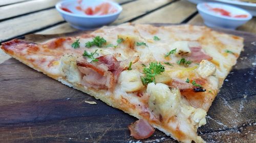 High angle view of pizza served on table