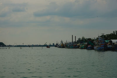 Scenic view of sea against buildings in city