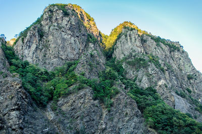 Low angle view of rocks against sky